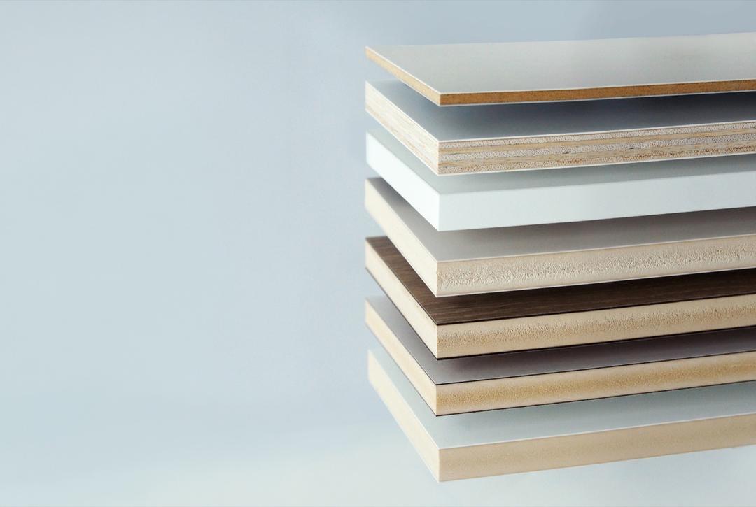 EGR Decor boards stacked to show their substrates and faces